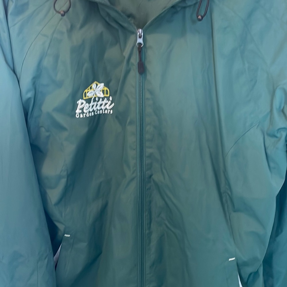 Womens raincoat size xl with Petitti emblem on chest